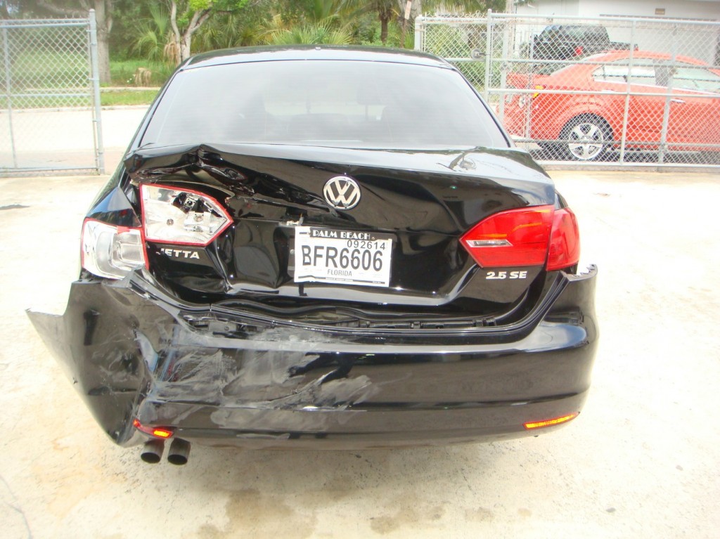 Photographs of a damaged Volkswagen Jetta that was repaired by Elite Paint & Body Shop in West Palm Beach Florida